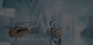 Doctor using digital tablet with medical icon and heartbeat rate